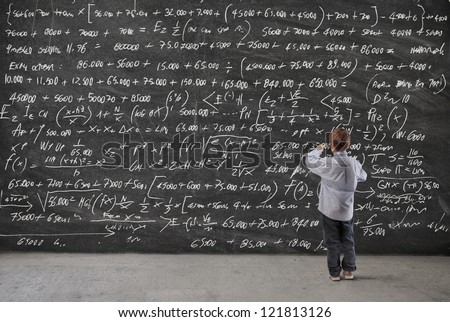 Child writing on a blackboard Child writing on a blackboard
