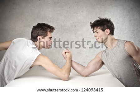 Two boy arm-wrestling