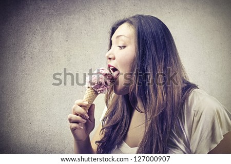 young fat woman eating ice cream