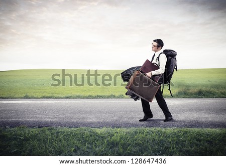 businessman walking on the street with a lot of luggage