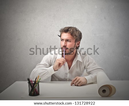 handsome man thinks of a project