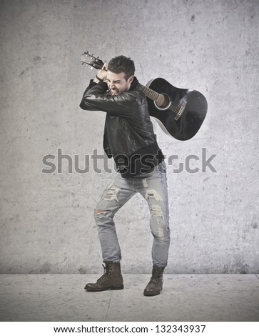 angry young boy wants to break guitar