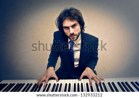 handsome man playing piano