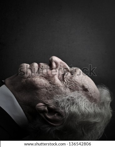 close-up old man lying down with eyes closed