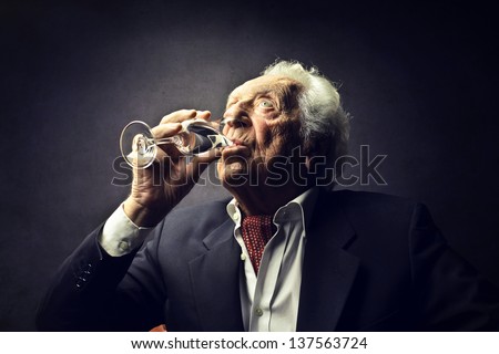 old man drinking champagne