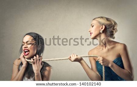beautiful blonde woman tied by woman screaming with fear