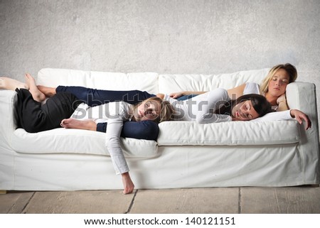 women sleeping on the sofa