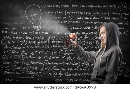young college student drawing on the chalkboard