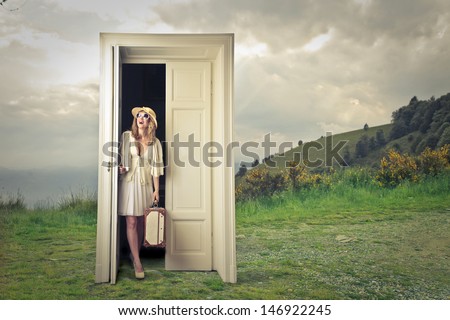 beautiful tourist opens a magic door