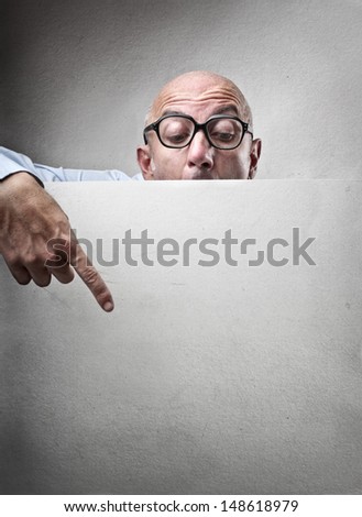 businessman points his finger on a poster