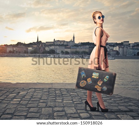 Beautiful Tourist With Vintage Suitcase Around The City