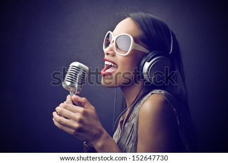 beautiful African woman singing with the microphone beautiful African woman singing with the microphone