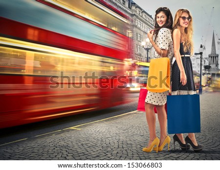 Beautiful Women With Shopping Bags At The Station