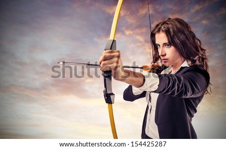 Beautiful Career Woman Pulls Arrow With A Bow