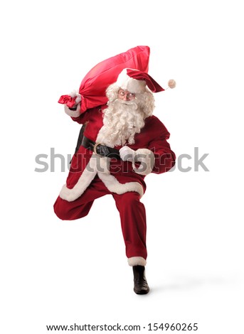 Santa Claus runs with big red sack Santa Claus runs with big red sack