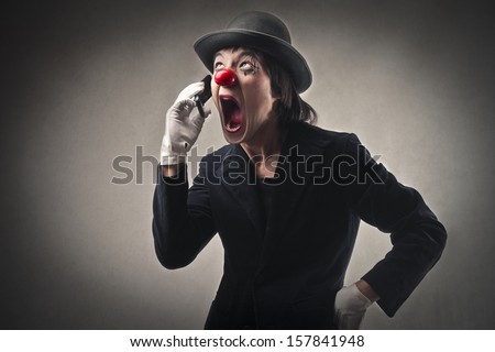 angry clown screaming on the phone