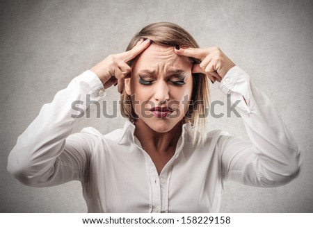 beautiful depressed woman with headache