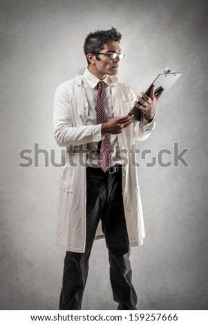 handsome doctor reading documents