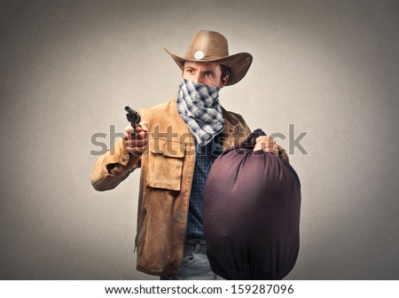 bandit with gun and big sack of money