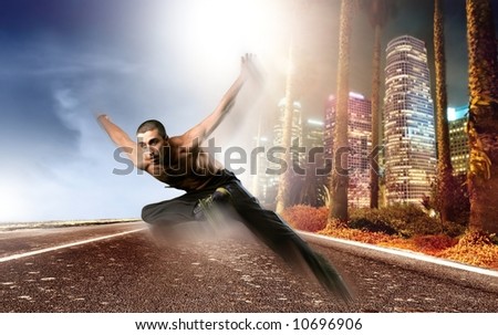 a young man run and dance on the street