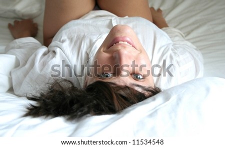 a portrait of a woman on the bed