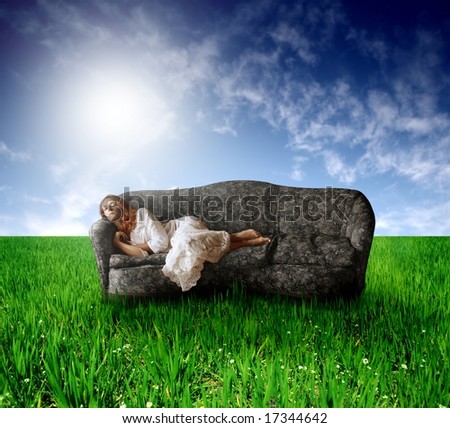 a woman on sofa in countryside