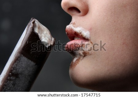 closeup of a lips of a woman and  ice-cream