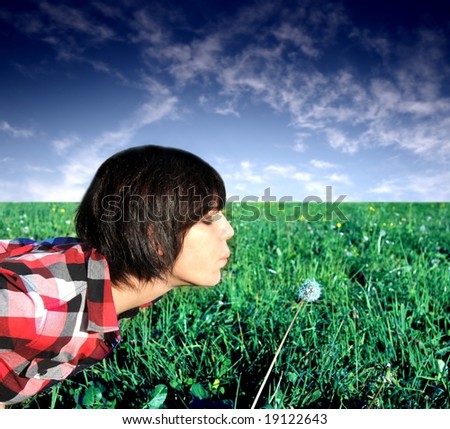 stock photo Girls blow the dandelion blossom