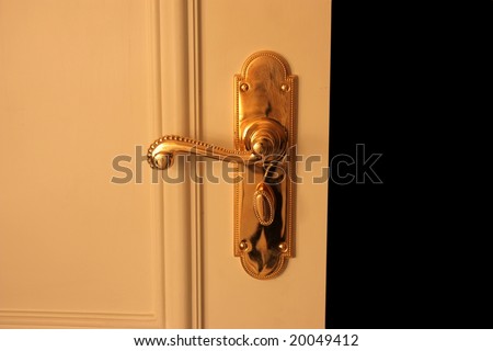 Detail of a an open door whit lock handle