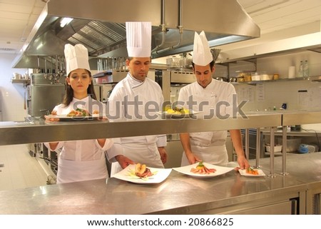 cooks in a kitchen of a restaurant