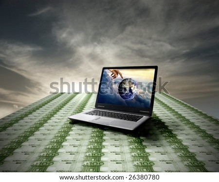 Laptop leaning on a euro banknotes floor