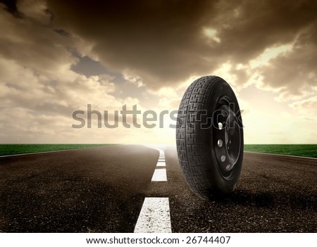 an isolated wheel on the road