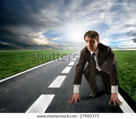 competition concept: business man starting a running
