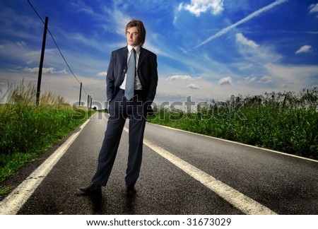 business man standing on the road