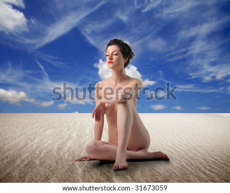 stock photo naked woman sited on the beach Save to a lightbox 