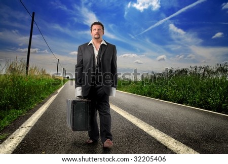 business man walking on country road