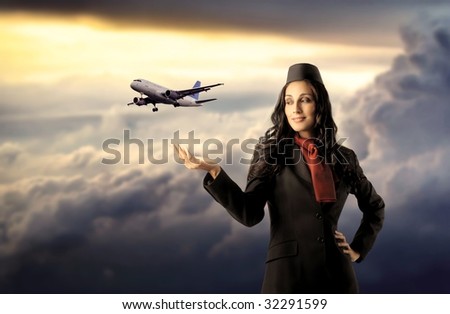beautiful air hostess with flying airplane