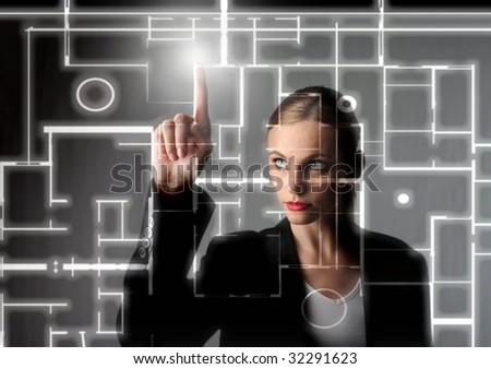 beautiful business woman drawing a digital blueprint