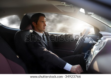 business man driving a sport car