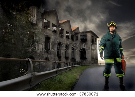 fireman standig near burnt factory