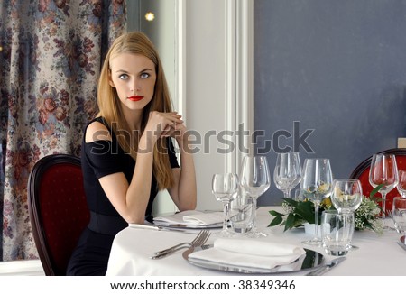 attractive woman waiting for someone at the restaurant table