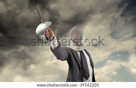business fight concept: businessman in fencing suit