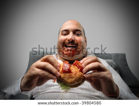 portrait of fat man eating hamburger