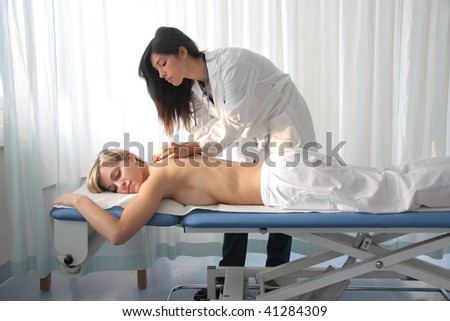 woman getting massage in a spa center