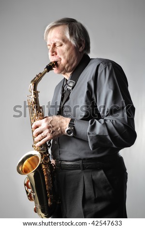 senior man playing sax