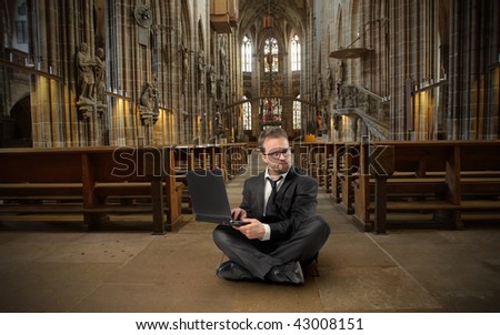 businessman with laptop in a church