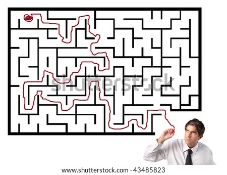 businessman solving a labyrinth game
