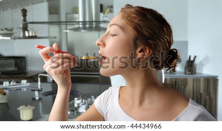 profile of girl eating cereals in a kitchen