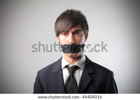 Portrait of a businessman with a bandage on his mouth