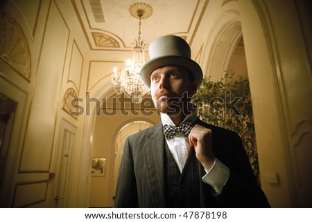 Portrait of a gentleman standing in a hall of a luxury hotel
